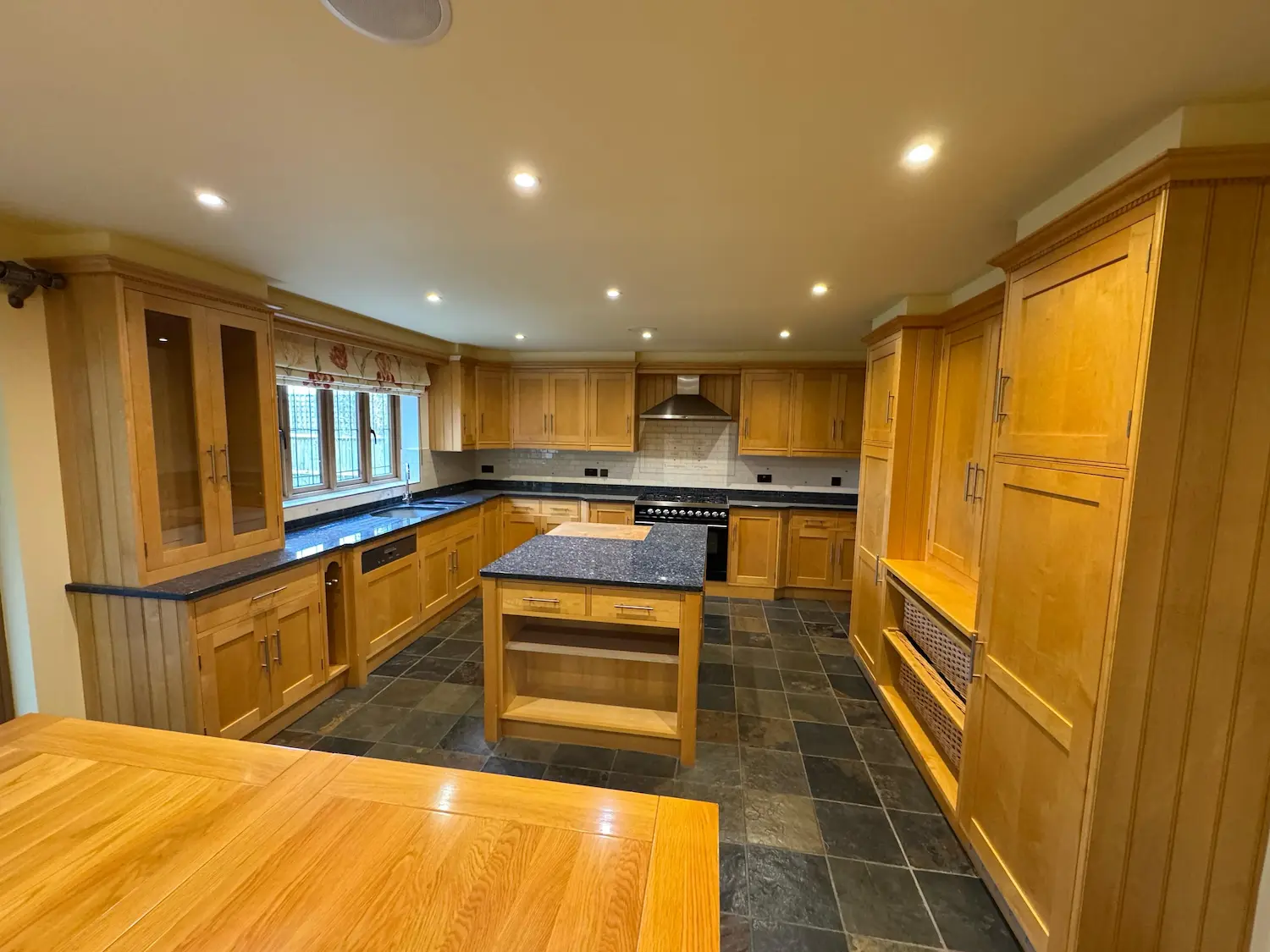 Before - Spacious light oak kitchen with central island before respray